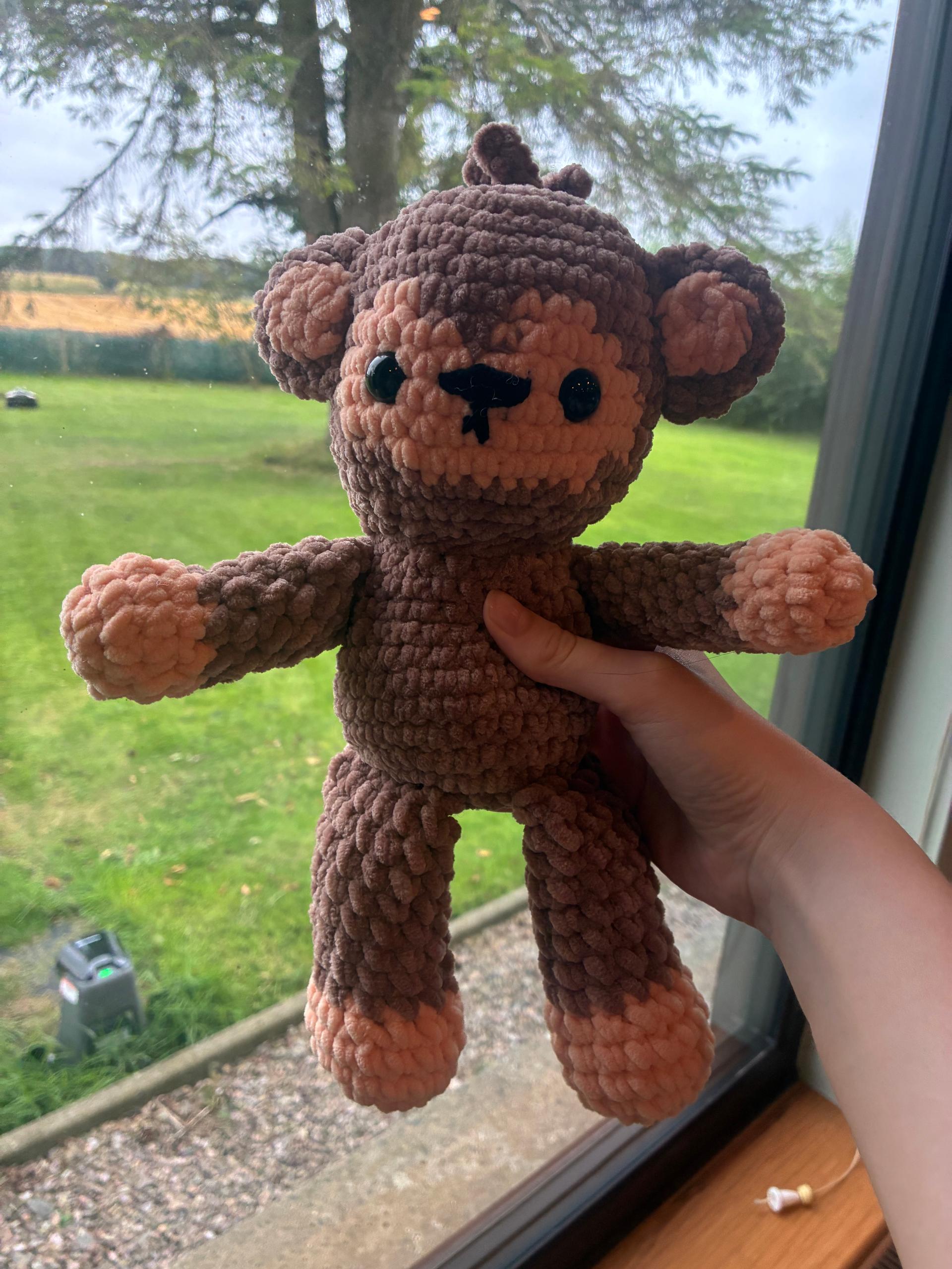Peach and brown crochet monkey