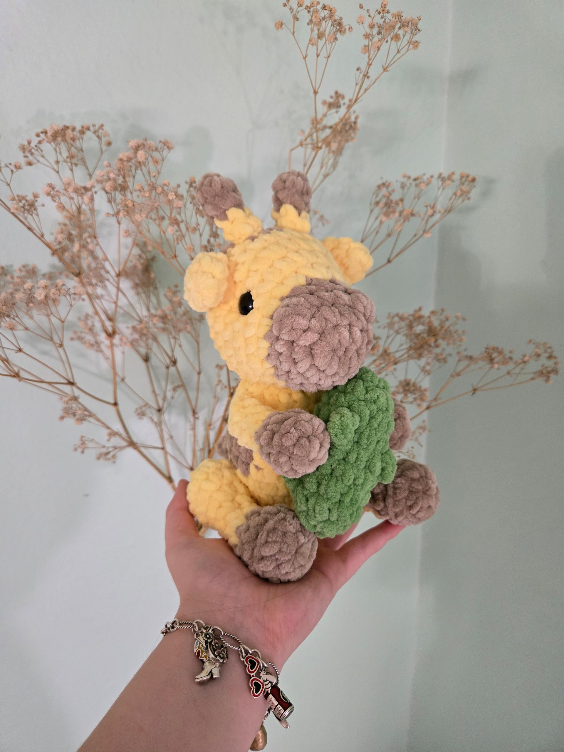 giraffe holding a pickle