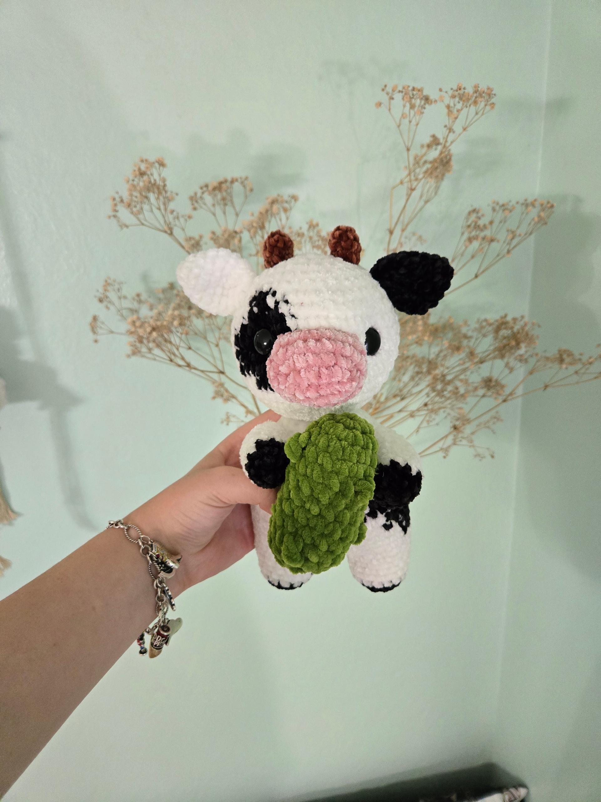 Cow holding a pickle